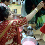 Goyni's toe washed and chandalo done on forehead.