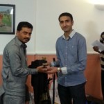 Dilipbhai Karavadra presenting award to Devraj Gadhvi